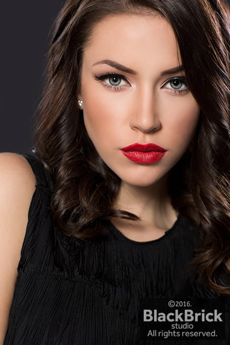 Beauty portrait of brunette with red lipstick